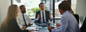 Finance, investor or business people in meeting with group for feedback and discussion or teamwork.